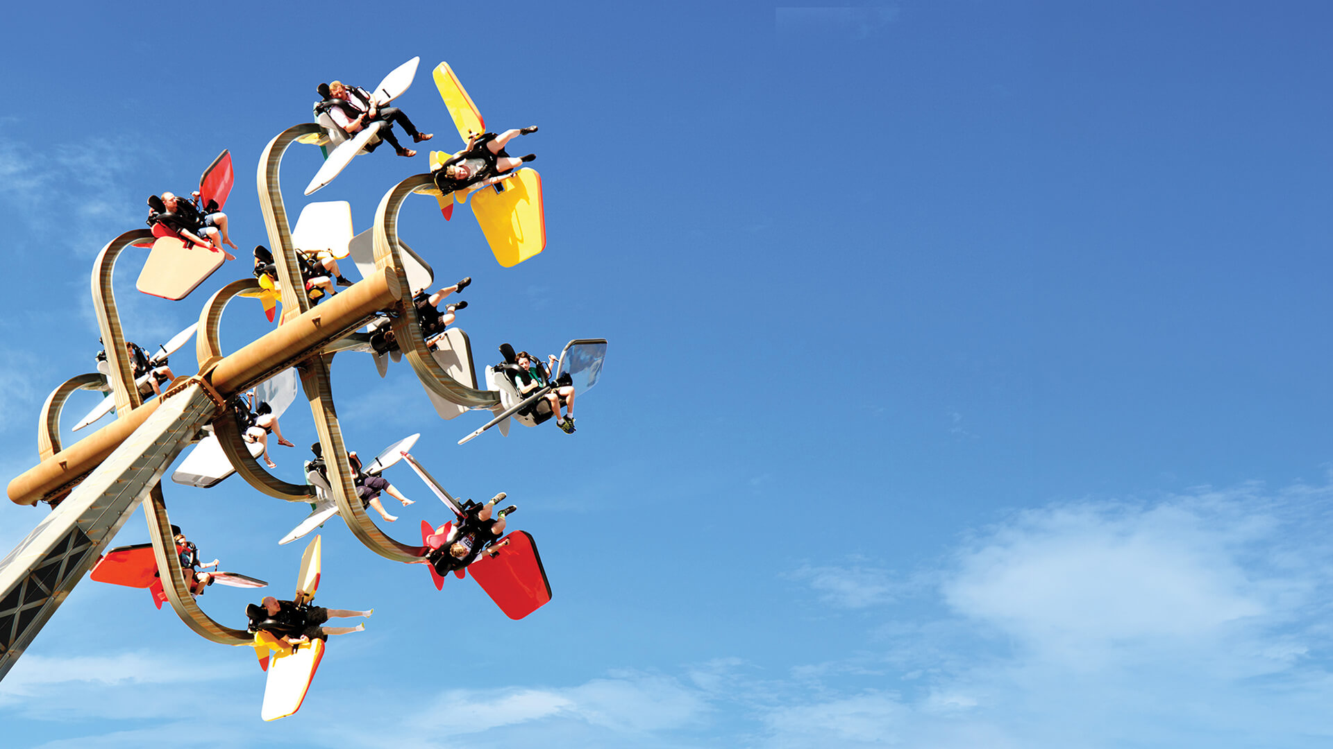 People on a roller coaster at Dreamworld having fun