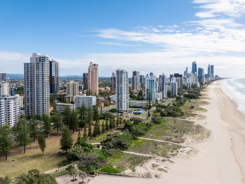 Ocean-view balcony from ULTIQA Points North overlooking the beach and turquoise water.