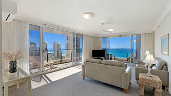 Light-filled living area with ocean-view balcony at ULTIQA Beach Haven on Broadbeach.