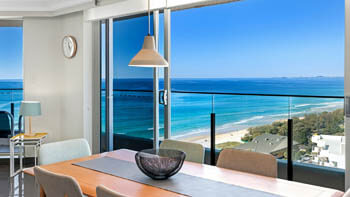 Dining area with panoramic ocean views from ULTIQA Beach Haven on Broadbeach.