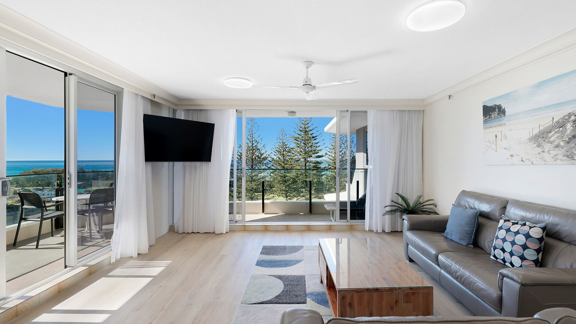 Bright beachfront living room with ocean-view balcony at ULTIQA Beach Haven on Broadbeach.