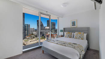 Master bedroom with city skyline views at ULTIQA Beach Haven on Broadbeach.