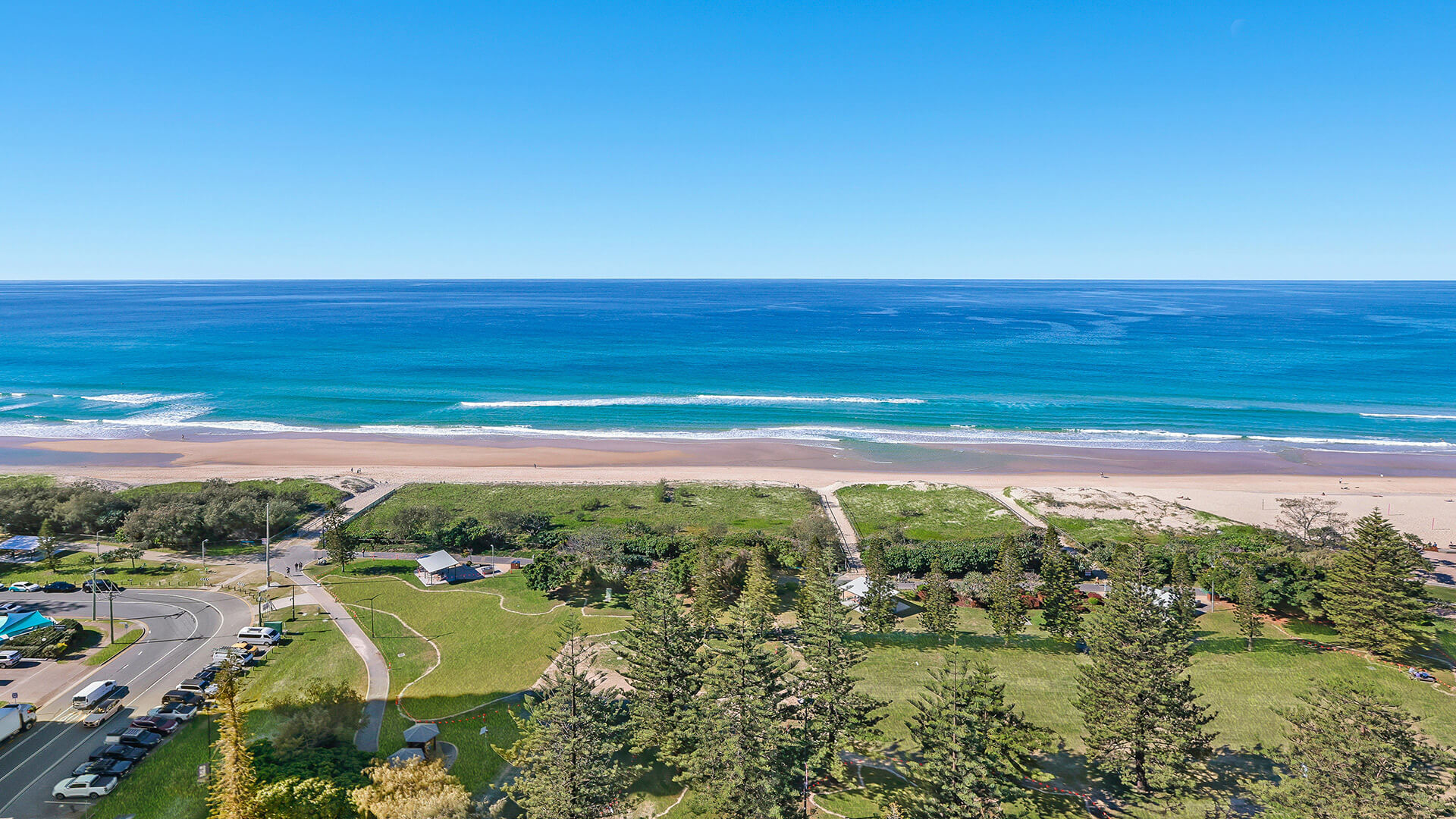 Elevated beachfront outlook across sand and ocean at ULTIQA Beach Haven on Broadbeach, Surfers Paradise, Gold Coast.