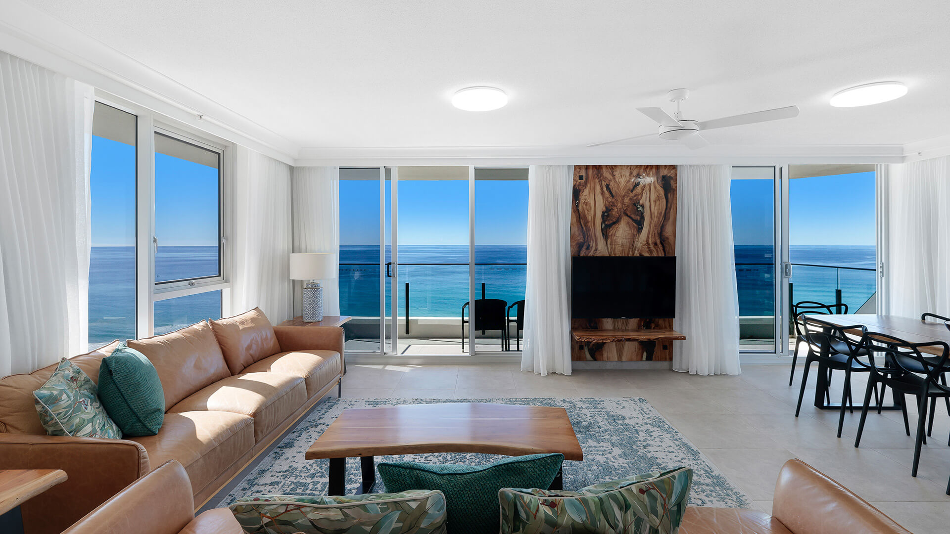 Lounge with balcony access and uninterrupted ocean views at ULTIQA Beach Haven on Broadbeach, Surfers Paradise.