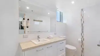 Bright bathroom with walk-in shower in the Sub Penthouse at ULTIQA Beach Haven on Broadbeach.