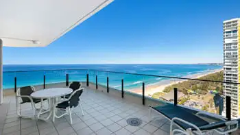 Expansive balcony in the Sub Penthouse at ULTIQA Beach Haven on Broadbeach, featuring outdoor dining and uninterrupted ocean views.